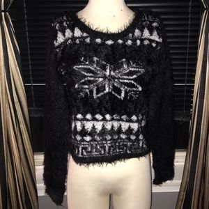 Fuzzy patterned Christmas sweater.